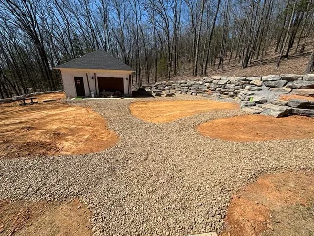 Wide gravel driveway and parking area at a Central Arkansas home site