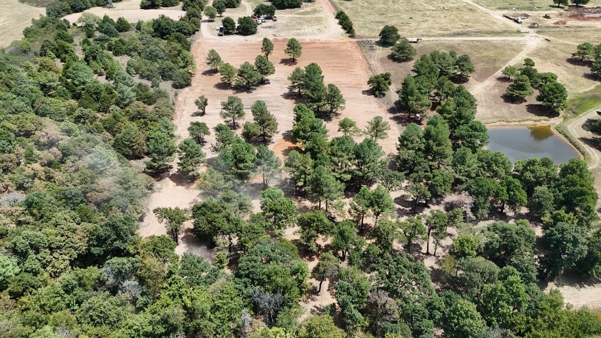 Aerial drone view of a Central Arkansas property with ponds and cleared acreage