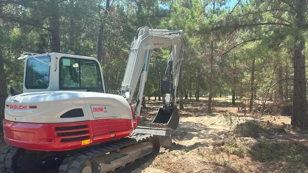 Takeuchi excavator working a wooded site in Central Arkansas